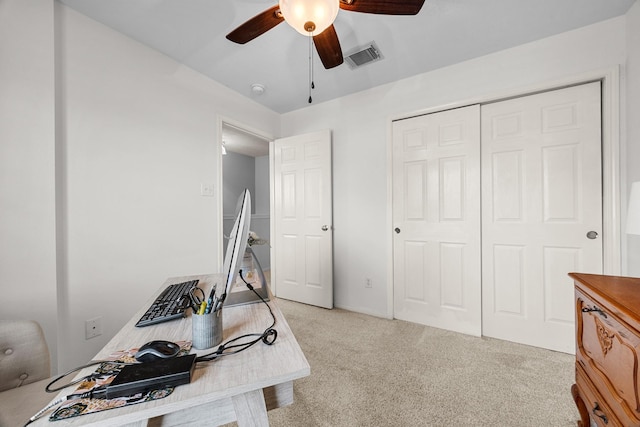 office with ceiling fan and light carpet