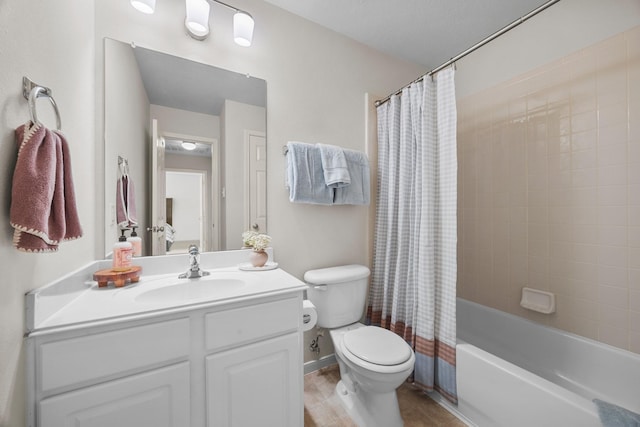 full bathroom with toilet, vanity, and shower / tub combo