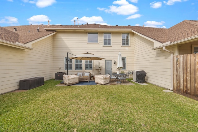 back of house with a patio, an outdoor living space, a yard, and cooling unit