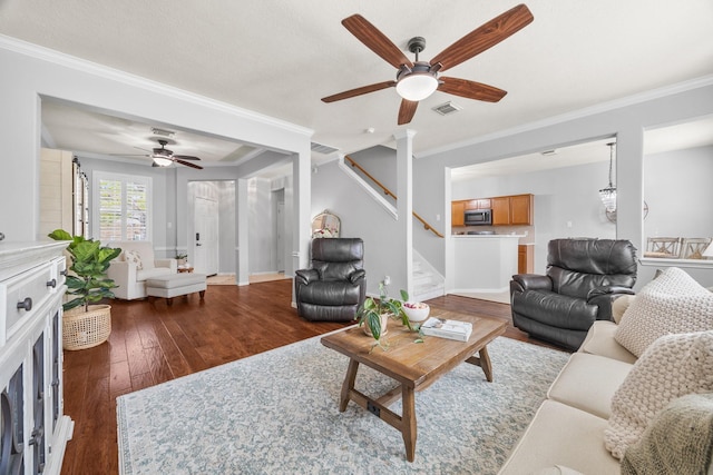 living room with ceiling fan, crown molding, and dark hardwood / wood-style flooring