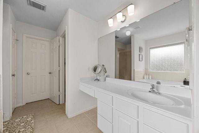 bathroom featuring tile patterned floors, separate shower and tub, and vanity