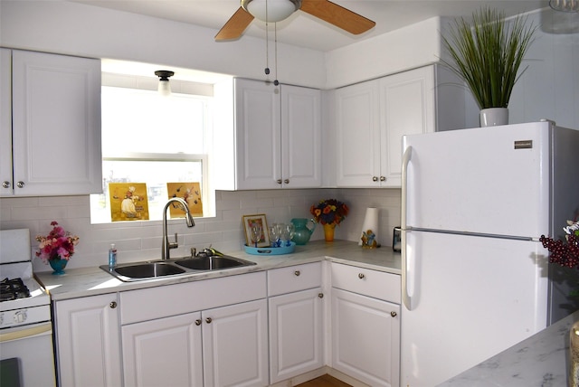 kitchen with white cabinetry, sink, white appliances, ceiling fan, and decorative backsplash