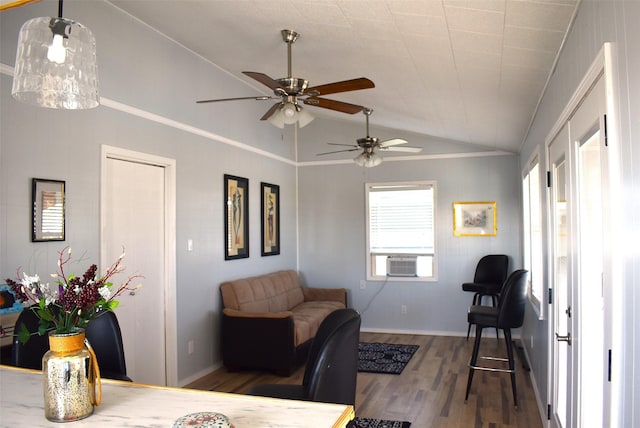 interior space with vaulted ceiling, hardwood / wood-style floors, and cooling unit