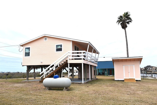 back of property featuring a yard