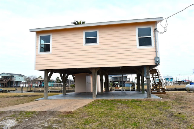 rear view of property featuring a carport