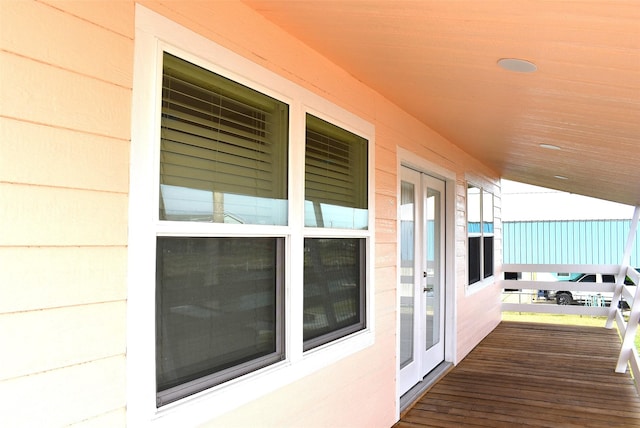 wooden deck featuring french doors