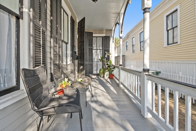 wooden terrace with a porch