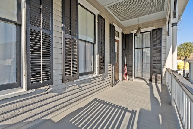 balcony with covered porch and visible vents