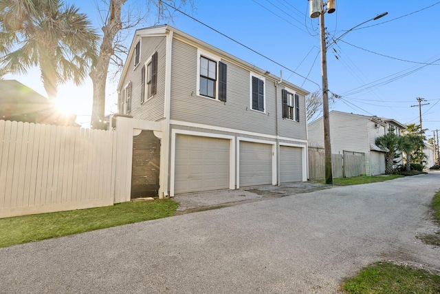 view of side of property featuring fence