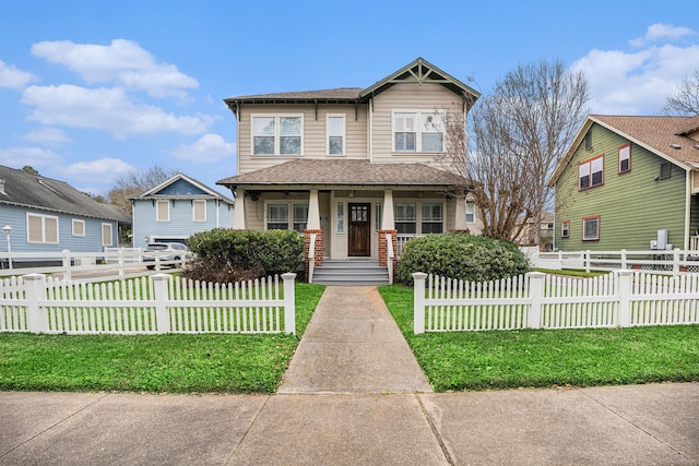 craftsman-style home featuring covered porch and a front lawn