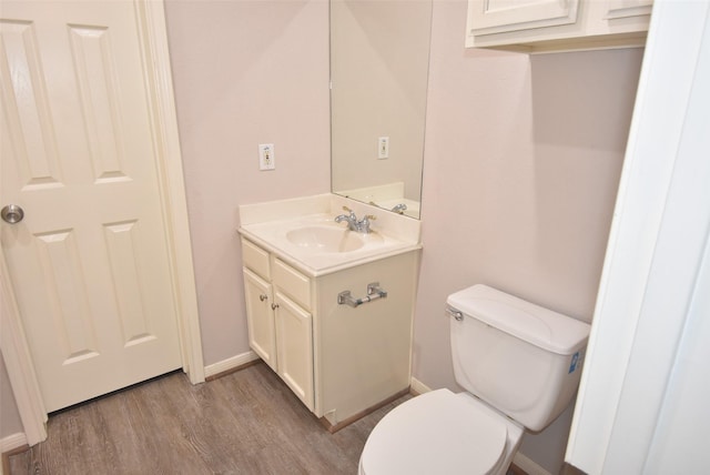 12565 Melville Dr Unit 224, Montgomery, TX 77356 - bathroom with toilet, vanity, and wood-type flooring