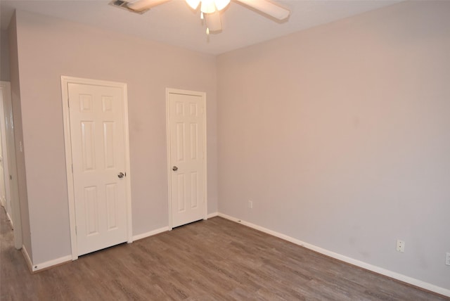 12565 Melville Dr Unit 224, Montgomery, TX 77356 - unfurnished bedroom with dark hardwood / wood-style flooring and ceiling fan