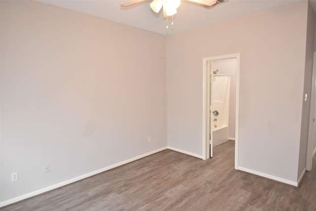 12565 Melville Dr Unit 224, Montgomery, TX 77356 - empty room featuring ceiling fan and wood-type flooring