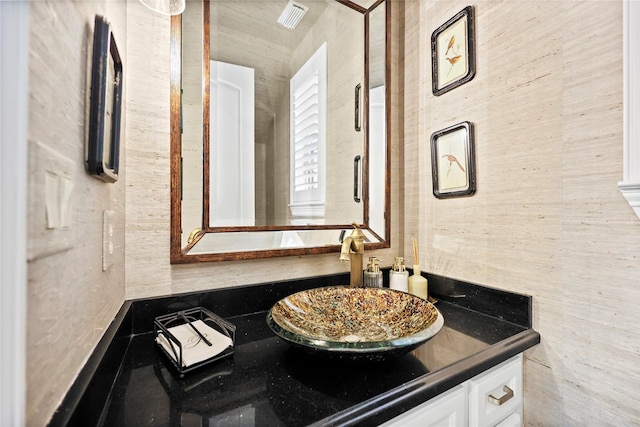 bathroom featuring visible vents and vanity