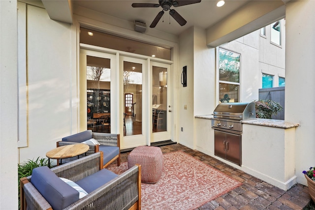 view of patio / terrace featuring a grill and ceiling fan