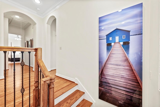 hall with baseboards, light wood-style flooring, recessed lighting, ornamental molding, and an upstairs landing