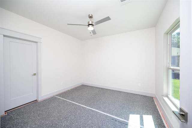 unfurnished room with ceiling fan