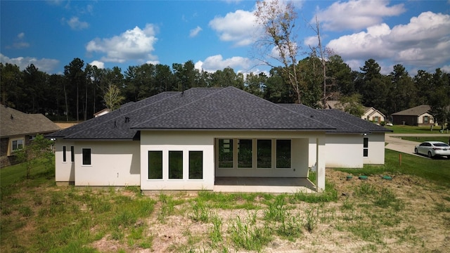 back of house featuring a yard and a patio area