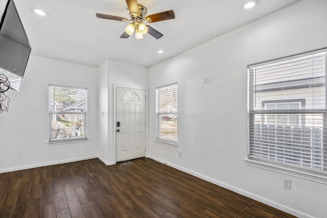 foyer with ceiling fan, dark wood-type flooring, and a healthy amount of sunlight