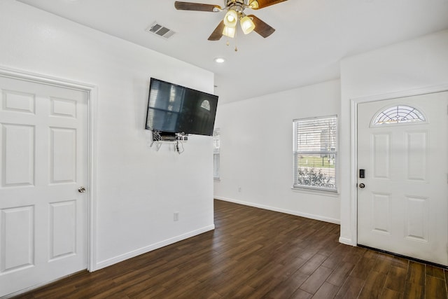 foyer featuring ceiling fan and dark wood-type flooring