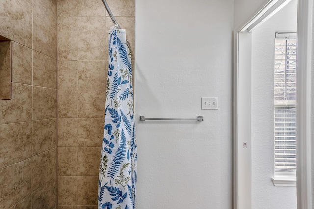 bathroom with curtained shower