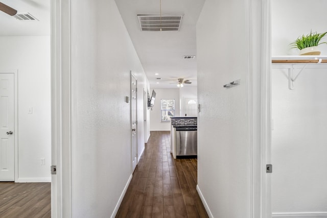 corridor with dark hardwood / wood-style floors