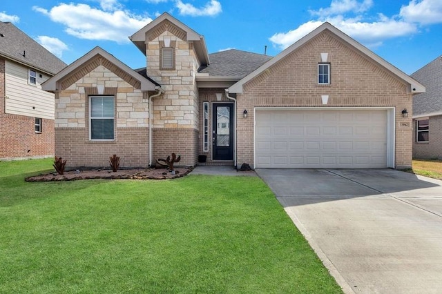 view of front of house with driveway, stone siding, an attached garage, a front yard, and brick siding