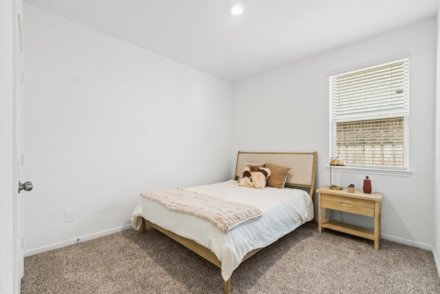 carpeted bedroom featuring recessed lighting and baseboards