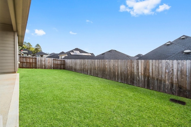 view of yard featuring a fenced backyard