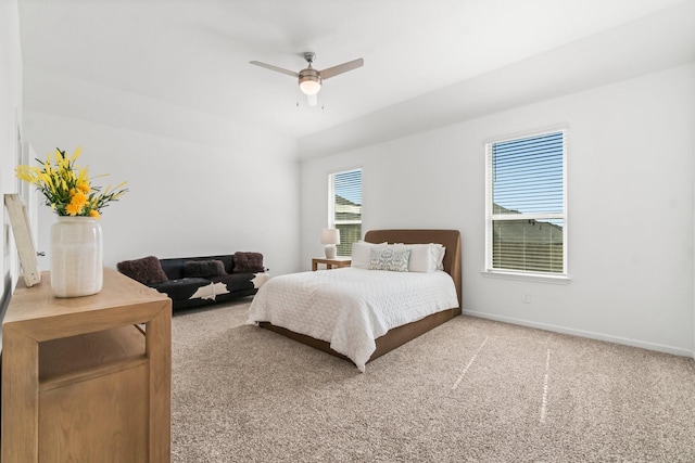 bedroom with a ceiling fan, baseboards, and carpet flooring