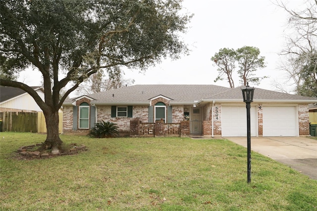 ranch-style house with brick siding, concrete driveway, an attached garage, fence, and a front lawn