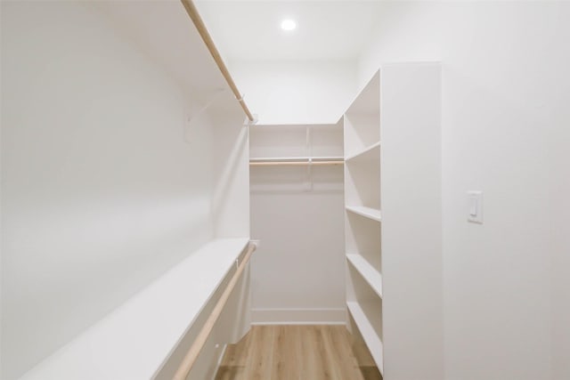 walk in closet featuring light wood-style floors