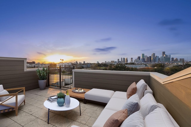 view of patio / terrace with a view of city and an outdoor living space