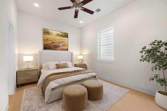 bedroom with visible vents, baseboards, a ceiling fan, light wood-style flooring, and recessed lighting