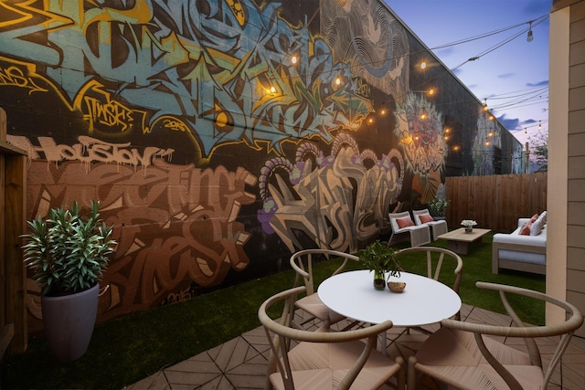 view of patio / terrace featuring fence private yard, outdoor dining area, and an outdoor hangout area