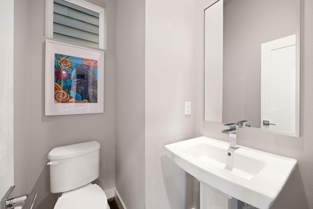 bathroom with a sink and toilet