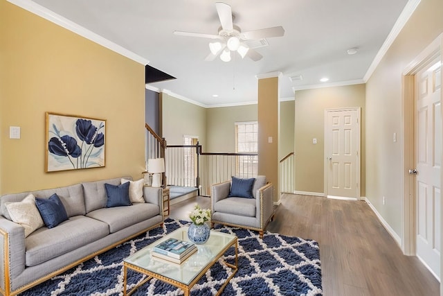 living room with crown molding, recessed lighting, a ceiling fan, wood finished floors, and baseboards