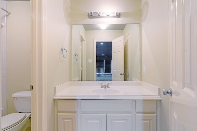 full bathroom with vanity and toilet