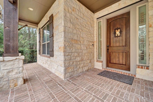 entrance to property with stone siding