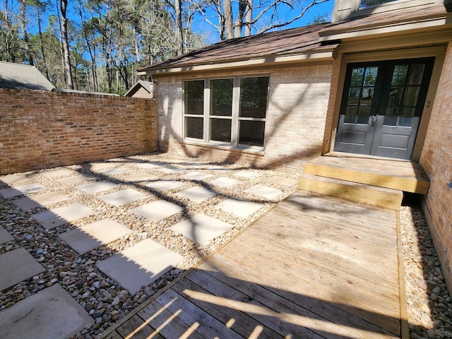 view of patio / terrace with french doors and fence