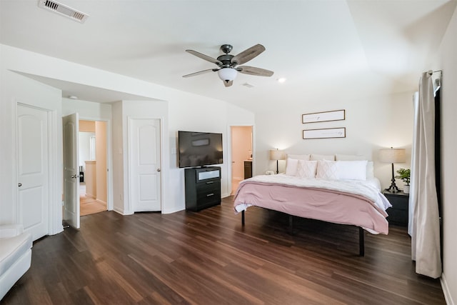 bedroom featuring dark wood-style floors, ceiling fan, visible vents, and baseboards