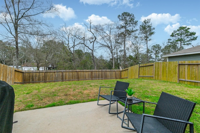 view of patio / terrace with grilling area and a fenced backyard