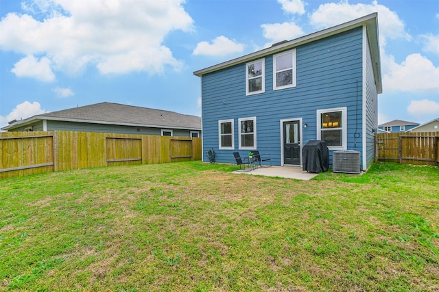 rear view of house featuring a yard, a patio area, a fenced backyard, and central air condition unit