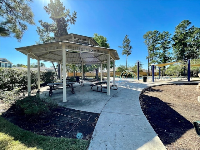 view of community featuring fence and a gazebo