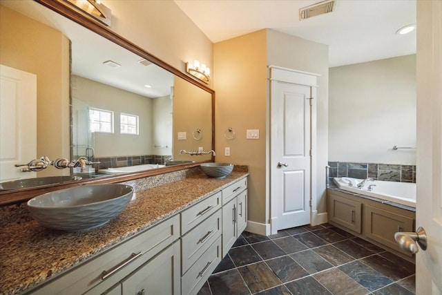 bathroom featuring vanity and plus walk in shower