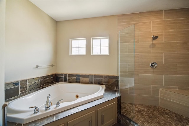 bathroom with shower with separate bathtub