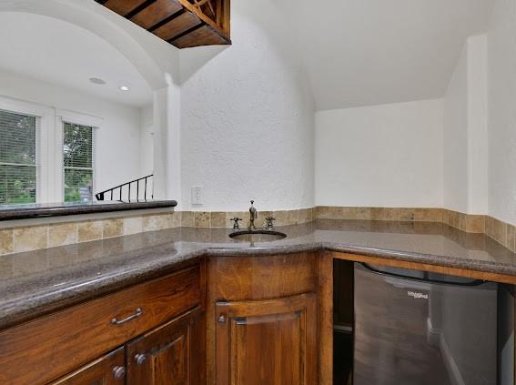 kitchen with dishwashing machine and sink