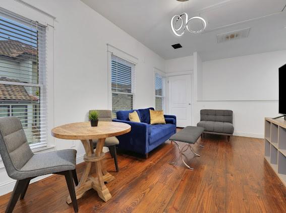 sitting room featuring dark hardwood / wood-style flooring