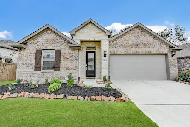 view of front of house with concrete driveway, a front lawn, an attached garage, and fence