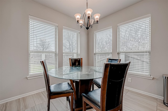 dining space featuring a notable chandelier